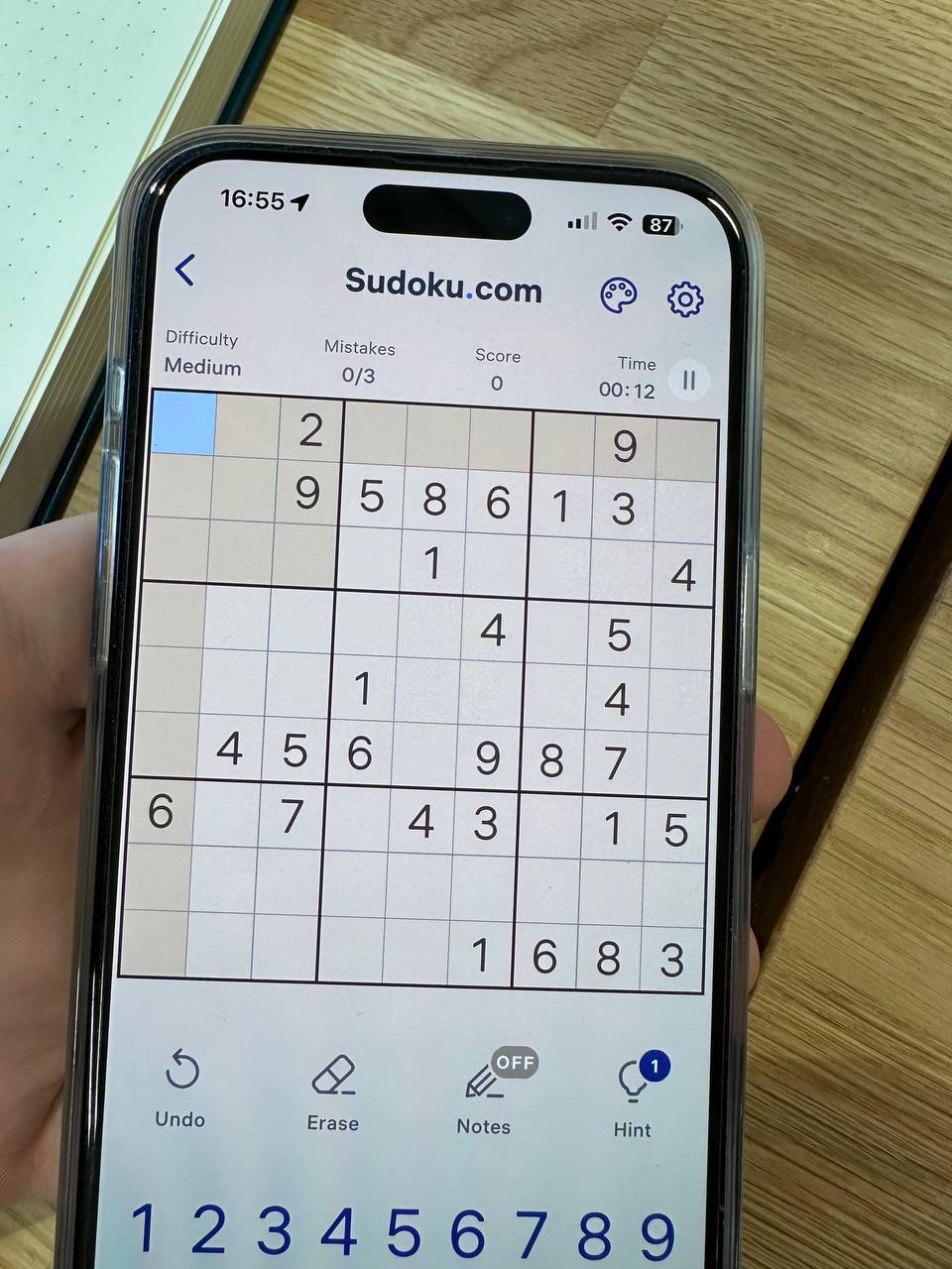 Photo of the phone with the Sudoku puzzle